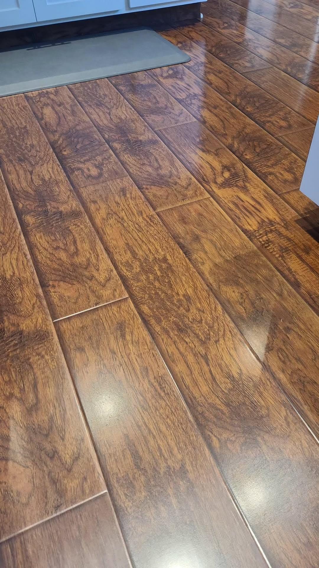 Close-up of polished hardwood grain and reflected light