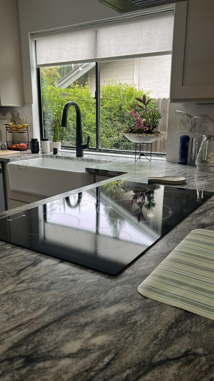 Polished kitchen island and cooktop after cleaning