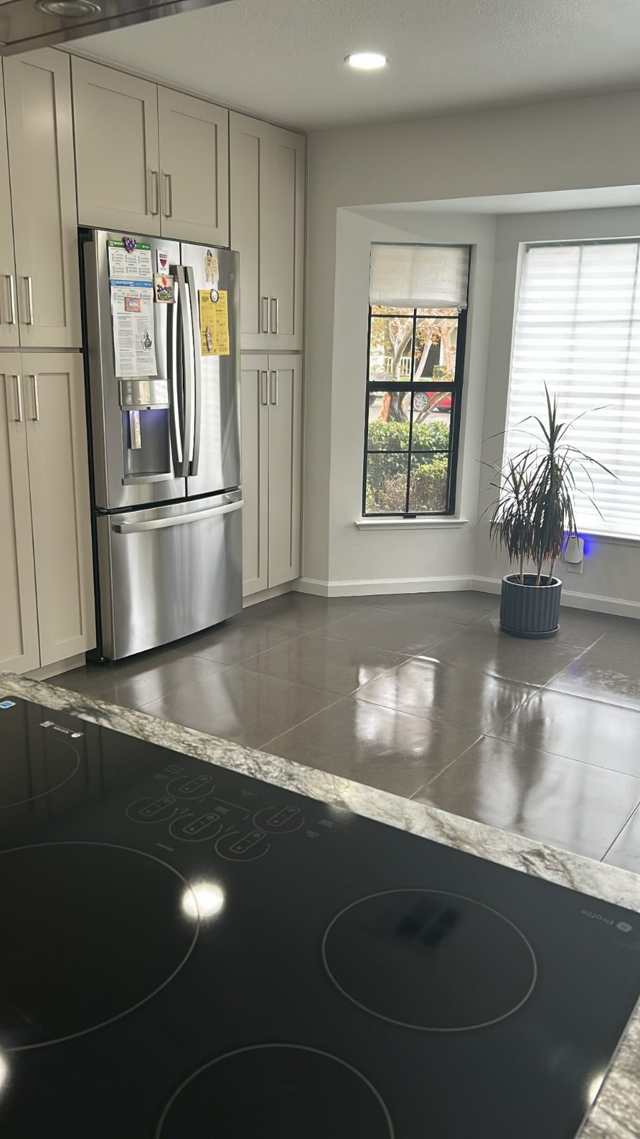 Spotless finished kitchen with stainless refrigerator