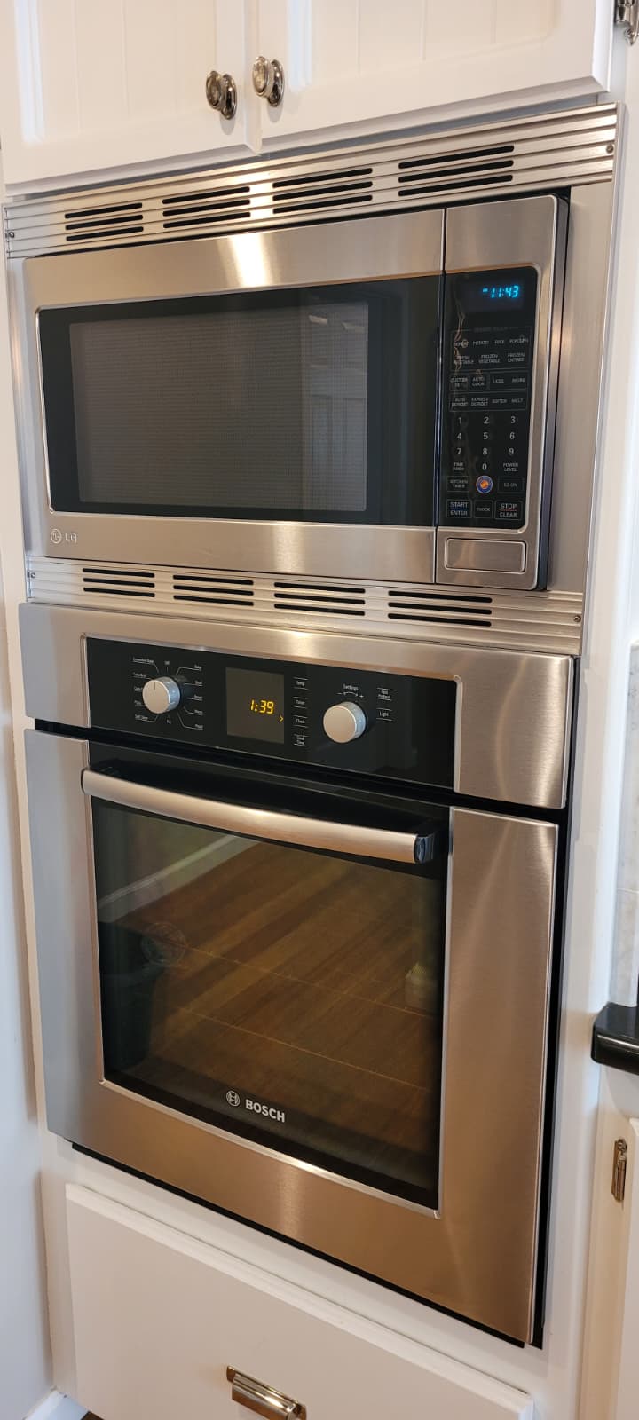 Clean stainless microwave and oven stack